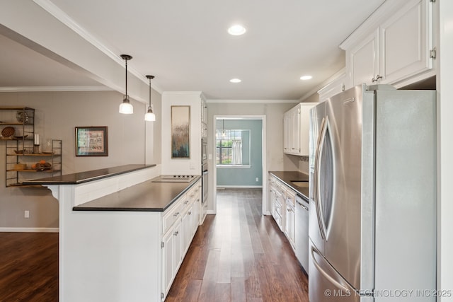 11029 E 66th St, Tulsa, OK 74133 - kitchen with stainless steel appliances, dark countertops, a peninsula, dark wood-type flooring, and a kitchen bar