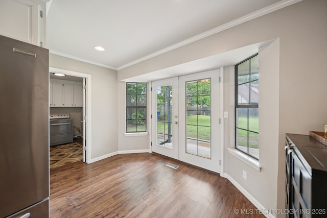 11029 E 66th St, Tulsa, OK 74133 - unfurnished living room with plenty of natural light, crown molding, french doors, dark wood finished floors, and recessed lighting