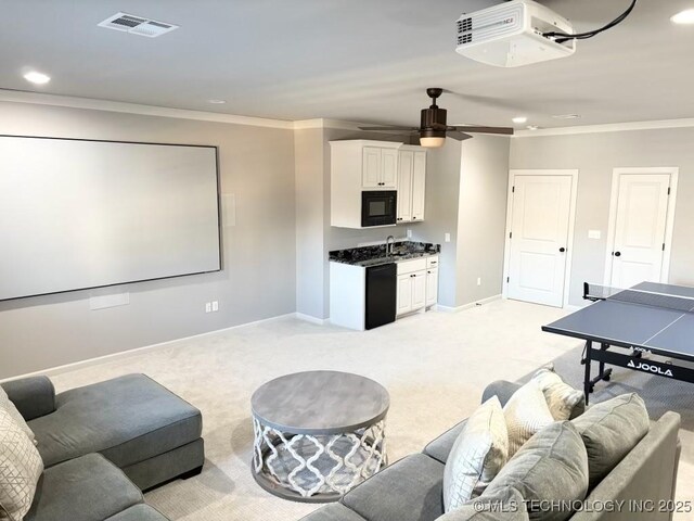 3816 E 117th Pl, Tulsa, OK 74137 - home theater with crown molding, recessed lighting, baseboards, light colored carpet, and a ceiling fan