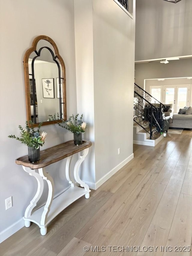 3816 E 117th Pl, Tulsa, OK 74137 - hall with hardwood / wood-style flooring, stairway, and baseboards