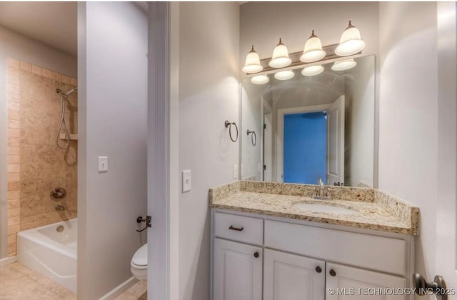 3816 E 117th Pl, Tulsa, OK 74137 - bathroom with vanity, shower / bathtub combination, toilet, tile patterned floors, and baseboards