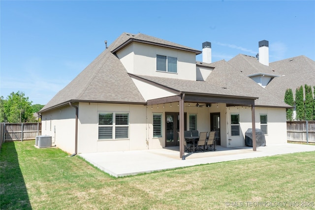 3816 E 117th Pl, Tulsa, OK 74137 - back of house featuring stucco siding, central air condition unit, a patio area, and roof with shingles