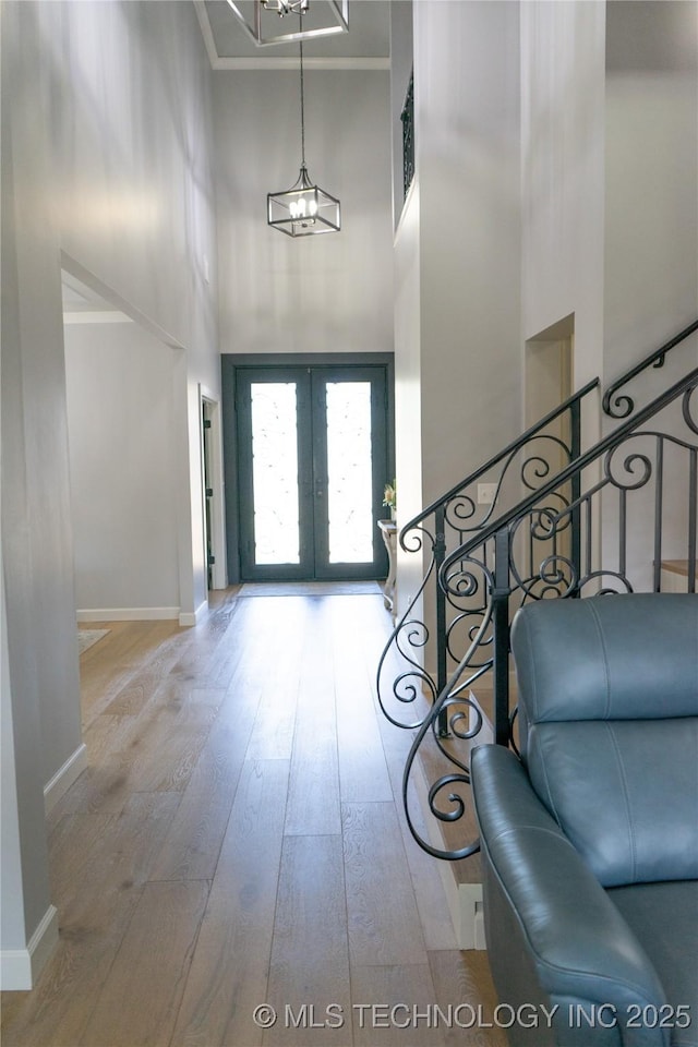3816 E 117th Pl, Tulsa, OK 74137 - foyer with a high ceiling, wood finished floors, baseboards, and french doors