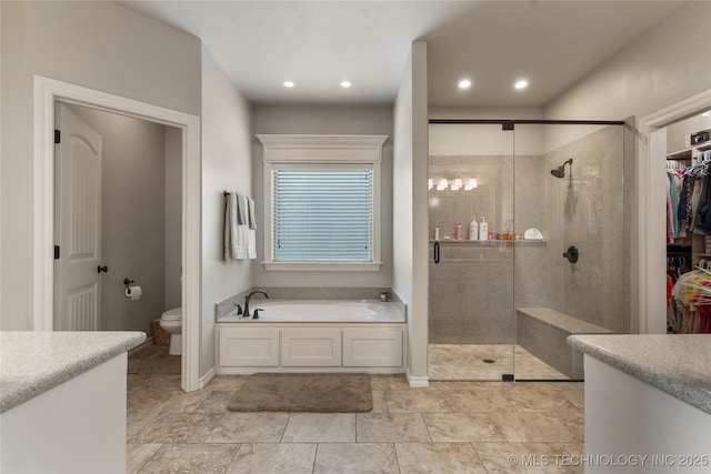 4472 S 169th E Ave, Tulsa, OK 74134 - full bath with a bath, a stall shower, toilet, a walk in closet, and vanity