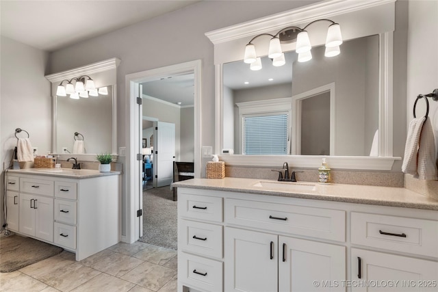 4472 S 169th E Ave, Tulsa, OK 74134 - bathroom featuring two vanities and crown molding