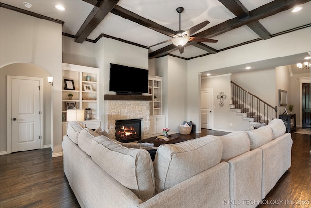 4472 S 169th E Ave, Tulsa, OK 74134 - living room with coffered ceiling, ceiling fan, a stone fireplace, dark wood-type flooring, and beam ceiling