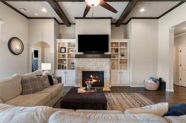 4472 S 169th E Ave, Tulsa, OK 74134 - living area featuring a ceiling fan, dark wood finished floors, beam ceiling, crown molding, and a fireplace