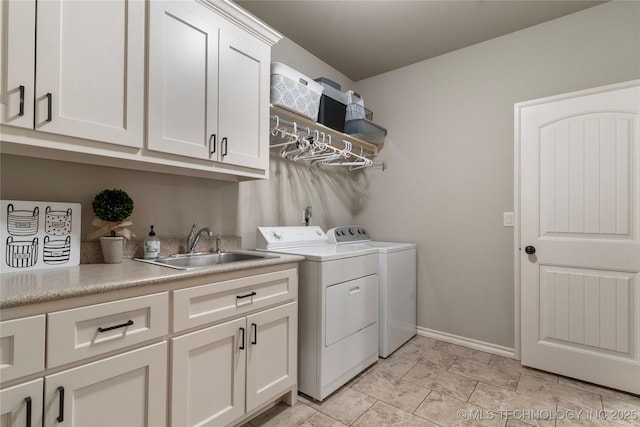 4472 S 169th E Ave, Tulsa, OK 74134 - washroom with washing machine and dryer, cabinet space, and baseboards
