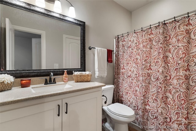 4472 S 169th E Ave, Tulsa, OK 74134 - bathroom with vanity, toilet, and a shower with shower curtain