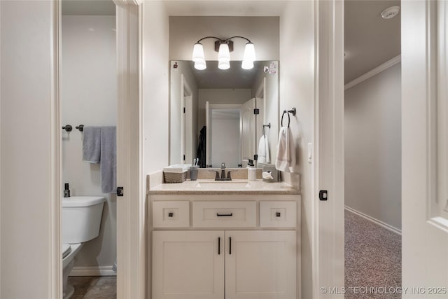 4472 S 169th E Ave, Tulsa, OK 74134 - bathroom with toilet, baseboards, vanity, and crown molding