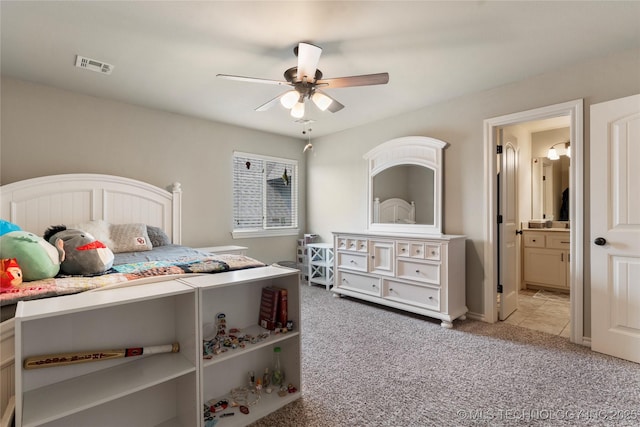 4472 S 169th E Ave, Tulsa, OK 74134 - bedroom with light colored carpet, ensuite bathroom, and ceiling fan