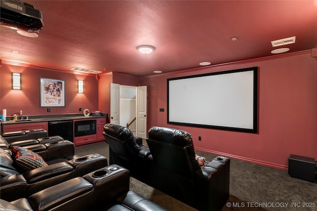 4472 S 169th E Ave, Tulsa, OK 74134 - home theater featuring dark carpet, crown molding, bar, and a textured ceiling