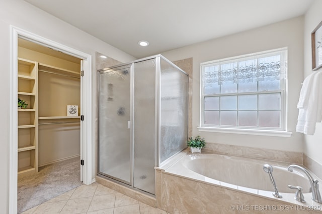 3012 W Mobile St, Broken Arrow, OK 74011 - bathroom featuring a walk in closet, a stall shower, a garden tub, tile patterned flooring, and recessed lighting