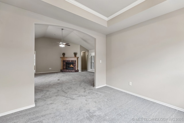 3012 W Mobile St, Broken Arrow, OK 74011 - unfurnished living room with carpet flooring, ceiling fan, a brick fireplace, ornamental molding, and vaulted ceiling