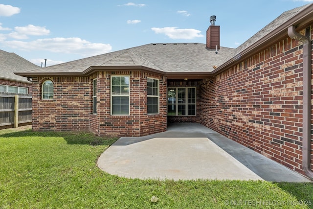 3012 W Mobile St, Broken Arrow, OK 74011 - rear view of house featuring a chimney, brick siding, a shingled roof, and a patio area