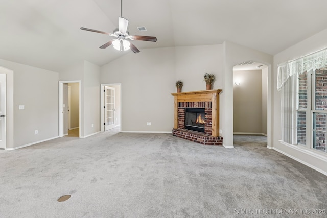 3012 W Mobile St, Broken Arrow, OK 74011 - unfurnished living room featuring a ceiling fan, carpet floors, arched walkways, a brick fireplace, and high vaulted ceiling