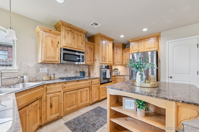 3012 W Mobile St, Broken Arrow, OK 74011 - kitchen with appliances with stainless steel finishes, open shelves, light brown cabinetry, dark stone counters, and decorative backsplash