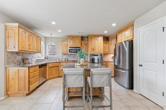 3012 W Mobile St, Broken Arrow, OK 74011 - kitchen with stainless steel appliances, a center island, backsplash, light brown cabinetry, and recessed lighting