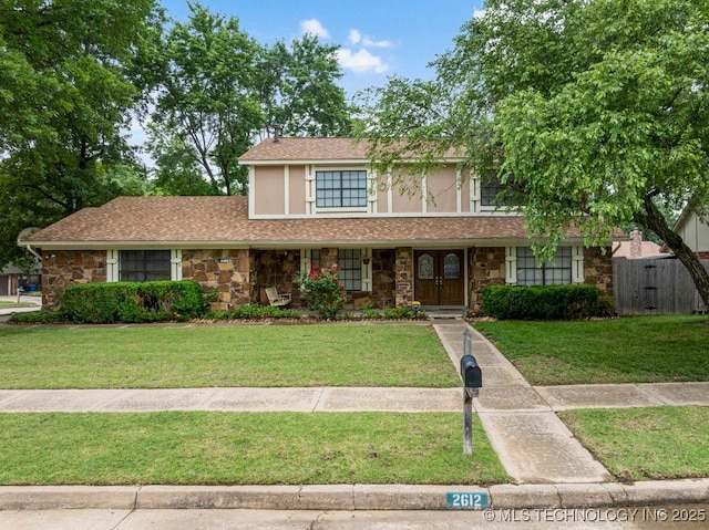 2612 W Quincy St, Broken Arrow, OK 74012 - traditional home with stone siding and a porch