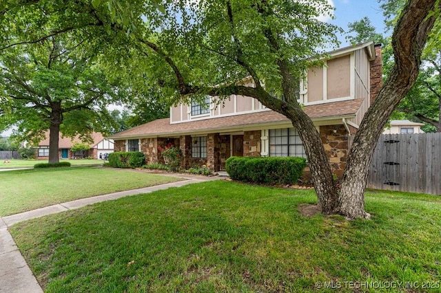 2612 W Quincy St, Broken Arrow, OK 74012 - view of front of property featuring stone siding, a chimney, and stucco siding