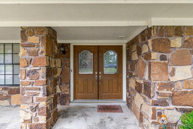 2612 W Quincy St, Broken Arrow, OK 74012 - entrance to property featuring stone siding and french doors