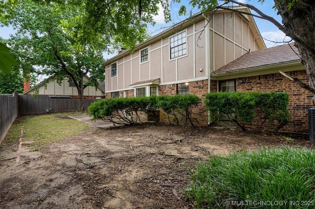 2612 W Quincy St, Broken Arrow, OK 74012 - rear view of property with a shingled roof and board and batten siding