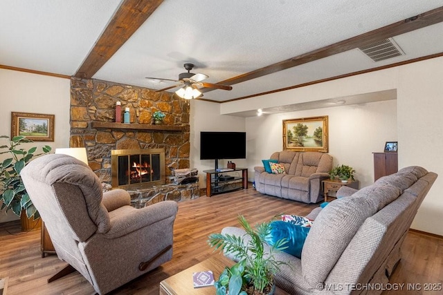 2612 W Quincy St, Broken Arrow, OK 74012 - living area featuring beam ceiling, a ceiling fan, a fireplace, wood finished floors, and crown molding
