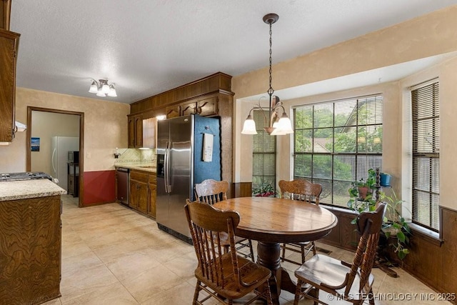 2612 W Quincy St, Broken Arrow, OK 74012 - dining space featuring a chandelier