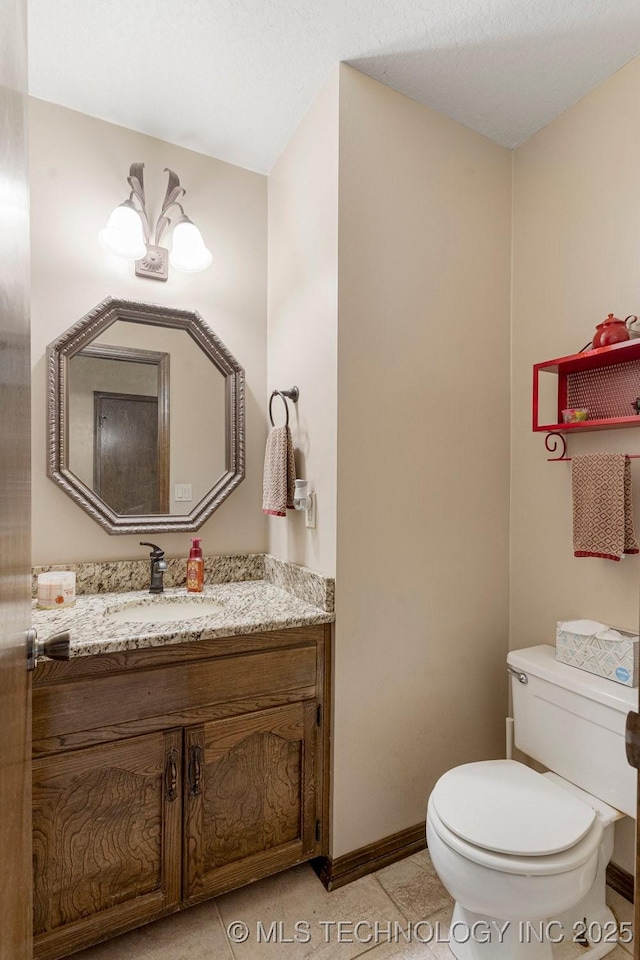 2612 W Quincy St, Broken Arrow, OK 74012 - half bathroom featuring toilet, vanity, and baseboards