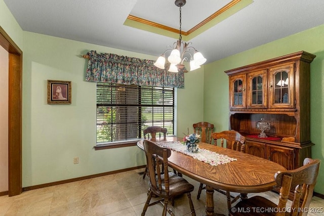 2612 W Quincy St, Broken Arrow, OK 74012 - dining space with a chandelier, a raised ceiling, and baseboards