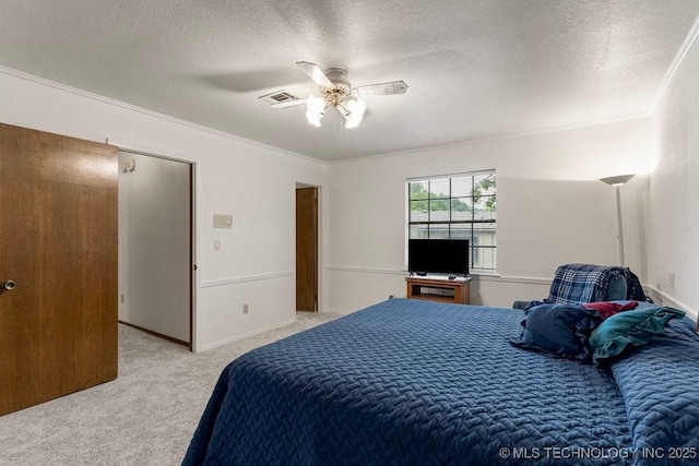 2612 W Quincy St, Broken Arrow, OK 74012 - bedroom featuring light colored carpet, ornamental molding, a textured ceiling, a ceiling fan, and baseboards
