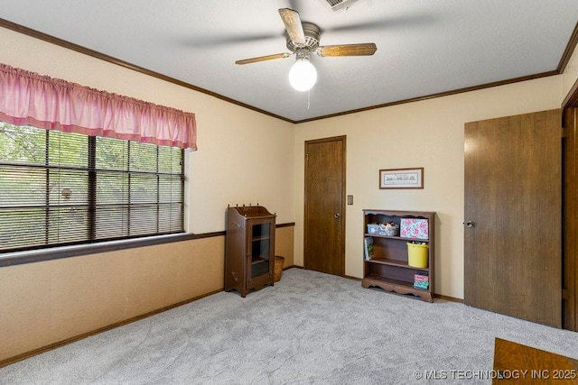 2612 W Quincy St, Broken Arrow, OK 74012 - carpeted bedroom featuring crown molding, ceiling fan, and baseboards
