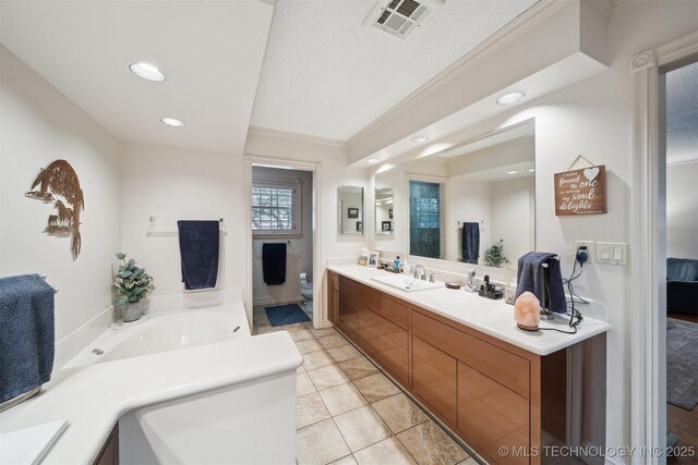625 Grove Crest Rd, Pryor, OK 74361 - bathroom with vanity, a garden tub, recessed lighting, toilet, and crown molding