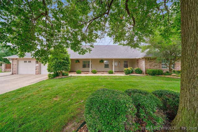 625 Grove Crest Rd, Pryor, OK 74361 - single story home with concrete driveway, a front lawn, a garage, and roof with shingles
