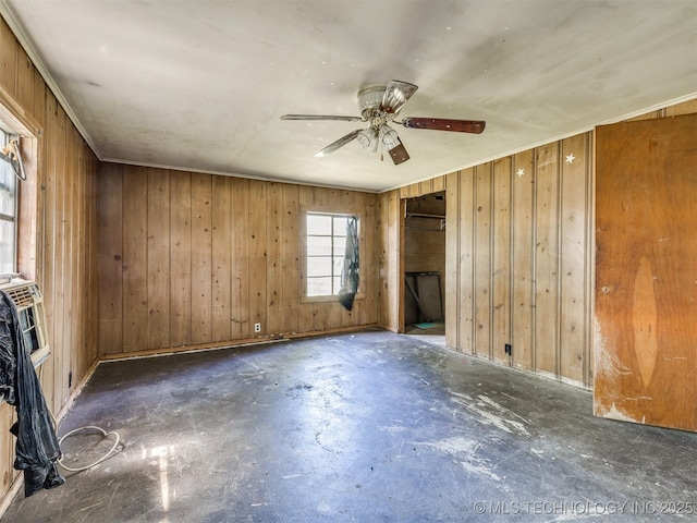 31229 E 682nd Rd, Wagoner, OK 74467 - spare room with concrete flooring, wooden walls, and ceiling fan