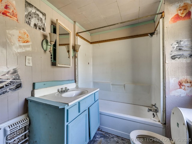 31229 E 682nd Rd, Wagoner, OK 74467 - bathroom featuring toilet, vanity, and bathing tub / shower combination