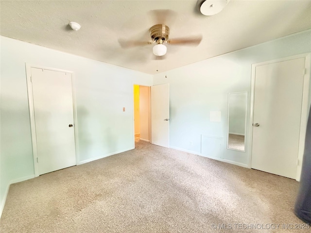 5641 S Newport Ave Unit 5641, Tulsa, OK 74105 - unfurnished bedroom with carpet flooring, baseboards, and a ceiling fan