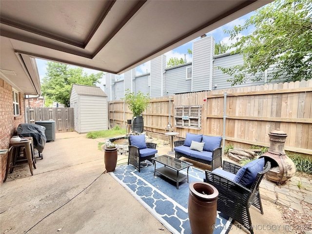 5641 S Newport Ave Unit 5641, Tulsa, OK 74105 - fenced backyard featuring an outdoor hangout area, a patio, and central AC