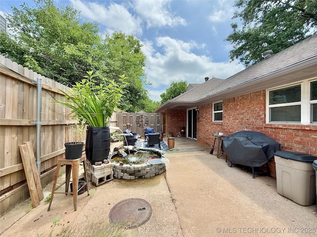 5641 S Newport Ave Unit 5641, Tulsa, OK 74105 - fenced backyard with a patio area and a grill