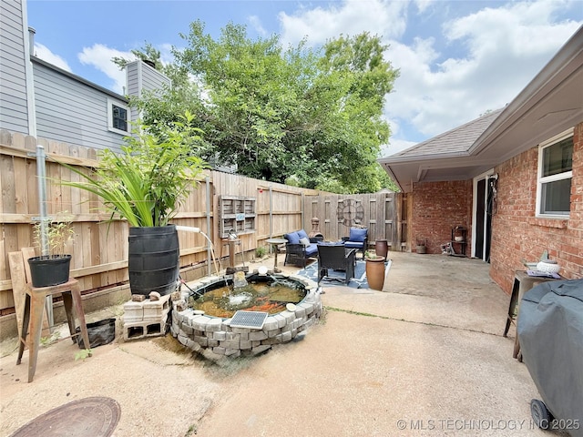 5641 S Newport Ave Unit 5641, Tulsa, OK 74105 - fenced backyard with a patio area