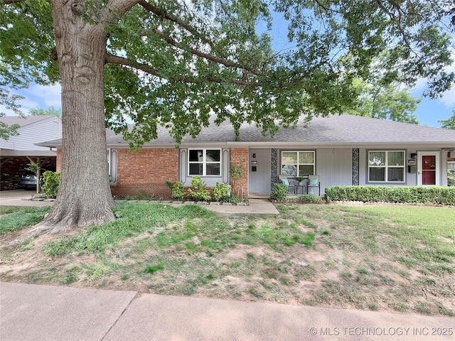 5641 S Newport Ave Unit 5641, Tulsa, OK 74105 - single story home featuring covered porch, a front lawn, and brick siding