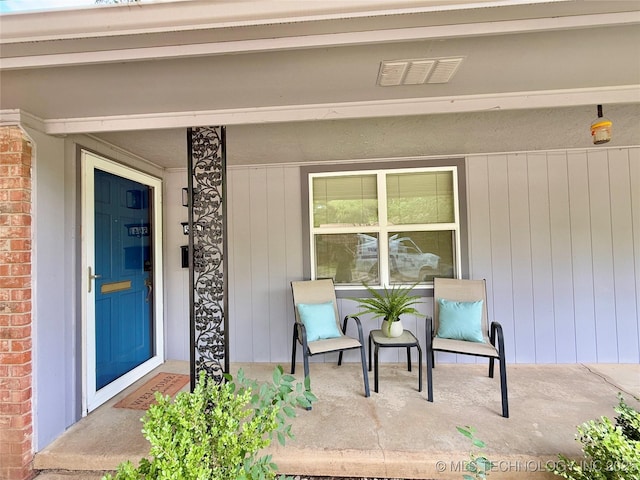 5641 S Newport Ave Unit 5641, Tulsa, OK 74105 - view of exterior entry with a porch