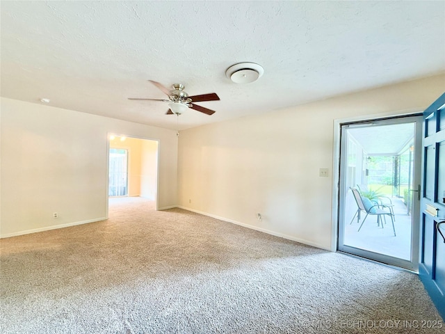 5641 S Newport Ave Unit 5641, Tulsa, OK 74105 - empty room featuring carpet, ceiling fan, baseboards, and a textured ceiling