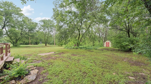 19826 S Covey Ct, Claremore, OK 74019 - view of grassy yard featuring a shed