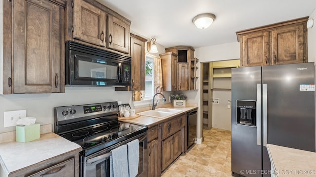 19826 S Covey Ct, Claremore, OK 74019 - kitchen with black appliances, light countertops, and open shelves