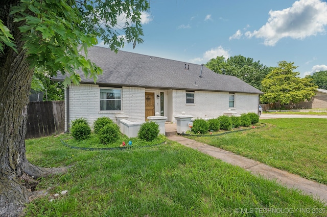 2806 S 136th Ave, Tulsa, OK 74134 - view of front of house with brick siding and a shingled roof