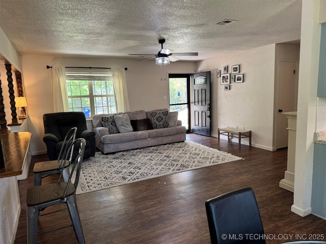 2752 Sawmill, Durant, OK 74701 - living room with a textured ceiling, wood finished floors, ceiling fan, and baseboards