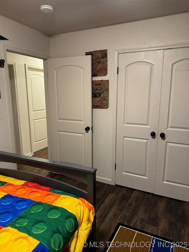 2752 Sawmill, Durant, OK 74701 - bedroom with dark wood finished floors and a closet