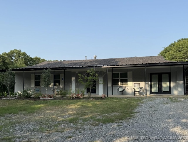 2752 Sawmill, Durant, OK 74701 - rear view of property featuring covered porch and a lawn