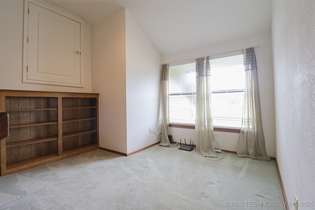9337 S Lakewood Ave, Tulsa, OK 74137 - empty room with light carpet, vaulted ceiling, and baseboards